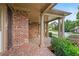 Inviting front porch with stately columns and brick flooring offering a welcoming entrance to the home at 307 Heritage Overlook, Woodstock, GA 30188