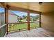 Relaxing screened-in porch area overlooking the backyard and neighboring homes at 307 Heritage Overlook, Woodstock, GA 30188