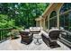 Charming back deck with comfortable seating and beautiful views of the lush backyard, ideal for outdoor gatherings at 1020 Matheson Way, Johns Creek, GA 30022