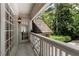 Inviting balcony with natural views and covered entryway for additional light at 1020 Matheson Way, Johns Creek, GA 30022