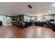 Spacious basement office features built-in shelves, modern desks, and sleek hardwood flooring, ideal for remote work at 1020 Matheson Way, Johns Creek, GA 30022