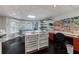 Well-lit craft room in basement with storage, natural light, and organized workspace; great for hobbies and creative projects at 1020 Matheson Way, Johns Creek, GA 30022