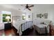Bedroom with wood floors, natural light, comfortable bed, and neutral decor at 1020 Matheson Way, Johns Creek, GA 30022