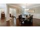 Formal dining room with hardwood floors, wainscoting and elegant chandelier at 1020 Matheson Way, Johns Creek, GA 30022