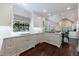 Gourmet kitchen with island, marble countertops, and custom white cabinetry at 1020 Matheson Way, Johns Creek, GA 30022