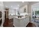 Gourmet kitchen with island, marble countertops, and custom white cabinetry at 1020 Matheson Way, Johns Creek, GA 30022
