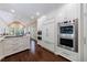 Spacious kitchen with a large island, hardwood floors and stainless steel appliances at 1020 Matheson Way, Johns Creek, GA 30022