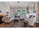 Bright living room with vaulted ceiling, fireplace, and arched windows at 1020 Matheson Way, Johns Creek, GA 30022