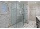 Beautiful glass shower with marble tile, multiple shower heads, and bright lighting in the bathroom at 1020 Matheson Way, Johns Creek, GA 30022