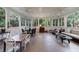 Charming sunroom with tile floors and lots of windows bringing the outdoors in at 1020 Matheson Way, Johns Creek, GA 30022