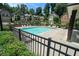 Community pool area is fenced in with lounge chairs and landscaping at 1878 Weston Ln, Tucker, GA 30084