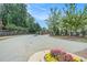 Inviting community entrance with lush landscaping and well-maintained street at 1878 Weston Ln, Tucker, GA 30084