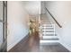 Welcoming foyer with hardwood floors and staircase, leading into living area at 1878 Weston Ln, Tucker, GA 30084