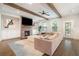 Comfortable living room with a fireplace, ceiling fan, exposed beams and a large sofa at 1878 Weston Ln, Tucker, GA 30084