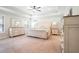 Spacious main bedroom with tray ceiling and neutral tones at 1878 Weston Ln, Tucker, GA 30084