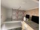 Modern bathroom with a shower and a unique accent wall creating a distinctive design at 4333 Dunwoody Park, Atlanta, GA 30338