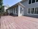Wide shot of wood deck with railing and siding visible in background, great for outdoor living at 5014 Dovecote Trl, Suwanee, GA 30024