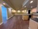 Finished basement featuring a kitchenette, bar, and hardwood floors at 5014 Dovecote Trl, Suwanee, GA 30024