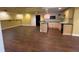 Finished basement featuring a kitchenette, bar, and hardwood floors at 5014 Dovecote Trl, Suwanee, GA 30024