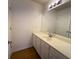 Bathroom featuring a spacious vanity, a large mirror, and modern lighting at 5014 Dovecote Trl, Suwanee, GA 30024