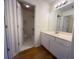 Bright bathroom with a spacious vanity and an open view of the toilet and shower at 5014 Dovecote Trl, Suwanee, GA 30024