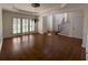 Spacious dining area with hardwood floors, a chandelier, and natural light at 5014 Dovecote Trl, Suwanee, GA 30024