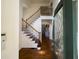 Welcoming home entryway featuring hardwood floors and a staircase with iron balusters at 5014 Dovecote Trl, Suwanee, GA 30024