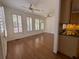 Spacious living area with hardwood floors, bright windows, and ceiling fans create a comfortable atmosphere at 5014 Dovecote Trl, Suwanee, GA 30024