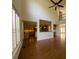 Bright living room with hardwood floors and an open layout to the kitchen at 5014 Dovecote Trl, Suwanee, GA 30024