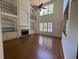 Spacious living room featuring high ceilings, fireplace, and built-in shelving at 5014 Dovecote Trl, Suwanee, GA 30024
