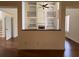 Grand living room view featuring built-in shelves and a fireplace, perfect for cozy gatherings at 5014 Dovecote Trl, Suwanee, GA 30024