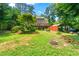 Large backyard with deck, and mature trees at 5018 Old Ivy Rd, Peachtree Corners, GA 30096