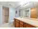 Bathroom with blue walls, a large mirror and vanity, and a walk-in shower at 5018 Old Ivy Rd, Peachtree Corners, GA 30096