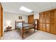 Bedroom featuring a wooden bed frame, closet, and carpeted floor at 5018 Old Ivy Rd, Peachtree Corners, GA 30096