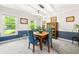 Bright dining room featuring blue and white walls, a wooden table, and lots of natural light at 5018 Old Ivy Rd, Peachtree Corners, GA 30096