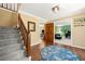 Foyer featuring hardwood floors, a staircase, and an entry way to an office at 5018 Old Ivy Rd, Peachtree Corners, GA 30096