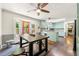 Spacious kitchen with an industrial table, colorful cabinets, and view into the living room at 5018 Old Ivy Rd, Peachtree Corners, GA 30096