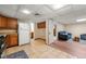 Basement kitchen area with wooden cabinets and view of the living space at 5018 Old Ivy Rd, Peachtree Corners, GA 30096