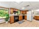 Kitchen features tile flooring, wood cabinets, black appliances, and ample sunlight at 5018 Old Ivy Rd, Peachtree Corners, GA 30096