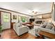 Inviting living room with a brick fireplace, lots of seating, and natural light at 5018 Old Ivy Rd, Peachtree Corners, GA 30096
