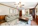 Bright living room with hardwood floors, neutral furniture, and a view into another room at 5018 Old Ivy Rd, Peachtree Corners, GA 30096