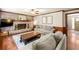 Comfortable living room with brick fireplace, wood mantel, and hardwood floors at 5018 Old Ivy Rd, Peachtree Corners, GA 30096
