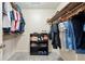 Walk-in closet features built in shelving for clothing and shoe storage at 5018 Old Ivy Rd, Peachtree Corners, GA 30096