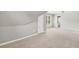 Finished attic space with neutral walls, carpeted floors, and access to bathroom at 672 Red Sunset Cir, Powder Springs, GA 30127