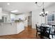 Eat-in kitchen features modern appliances, hardwood floors, and an adjacent dining area at 672 Red Sunset Cir, Powder Springs, GA 30127
