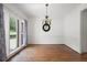 Elegant dining room with hardwood floors and a classic chandelier at 672 Red Sunset Cir, Powder Springs, GA 30127