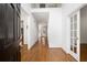 Bright foyer with hardwood floors and a view of the upper level balcony at 672 Red Sunset Cir, Powder Springs, GA 30127