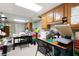 Spacious hobby room with ample storage cabinets, work tables, and bright overhead lighting at 672 Red Sunset Cir, Powder Springs, GA 30127
