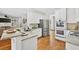 Stylish kitchen featuring stainless steel appliances, granite countertops, and hardwood floors at 672 Red Sunset Cir, Powder Springs, GA 30127
