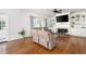Bright living room boasts hardwood floors, a fireplace, and custom built-in shelving and cabinetry at 672 Red Sunset Cir, Powder Springs, GA 30127